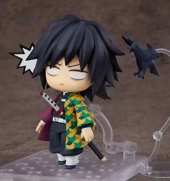 High-quality Demon Slayer Nendoroid Figures featuring Kamado Tanjiro, Nezuko, and Uzui Tengen posing for an upscale anime collection display.