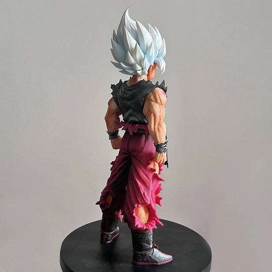 Son Goku Super Saiyan Action Figure displayed on anime desk Dragon Ball PVC collectible statue