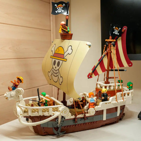 A detailed One Piece Going Merry Building Blocks set featuring the Straw Hat Pirate Ship, designed as an assembly model toy for children and collectors.