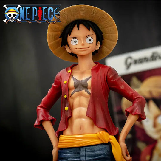 A 28cm One Piece Luffy Figure made of PVC, featuring three interchangeable face plates showing confident and smiley expressions for custom display.