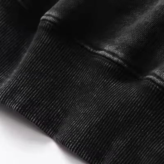 Close-up of the fabric texture on the Kenpachi Zaraki Bleach Vintage Washed Hoodie, showing the cotton fleece quality.