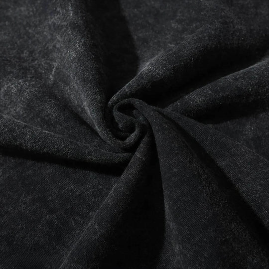 Close-up of the soft fabric texture of the Obito Uchiha Mask Acid Wash T-Shirt in black.