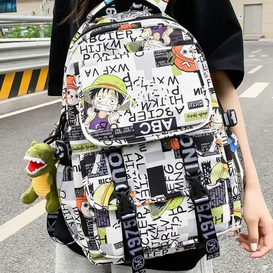 A high-capacity One Piece Luffy Backpack featuring a vibrant graffiti print of Monkey D. Luffy, designed as a durable school bag for middle and high students.