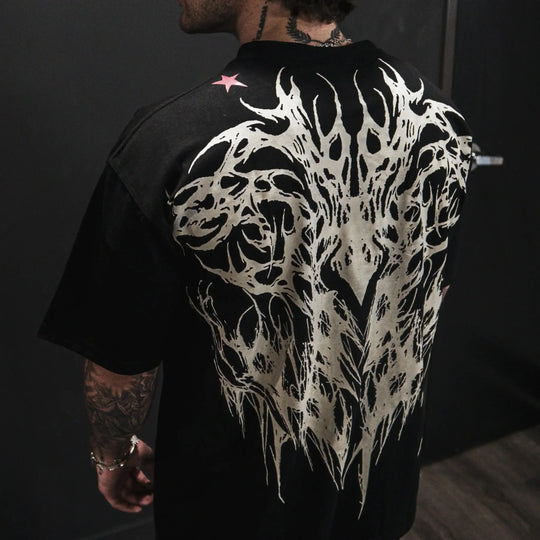 Dark Oversized Cotton Tee Skull Print shown on a model, highlighting the alternative fashion style suitable for men and women's streetwear and gym workouts.