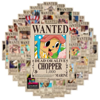 A pack of 50 One Piece Wanted Posters stickers and cool graffiti decals featuring Luffy and the Straw Hat crew, applied to a laptop and suitcase.