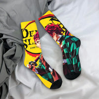 Breathable Demon Slayer Socks featuring Nezuko Kamado and Giyu Tomioka patterns, designed as trendy non-slip skateboard stockings for men and women.