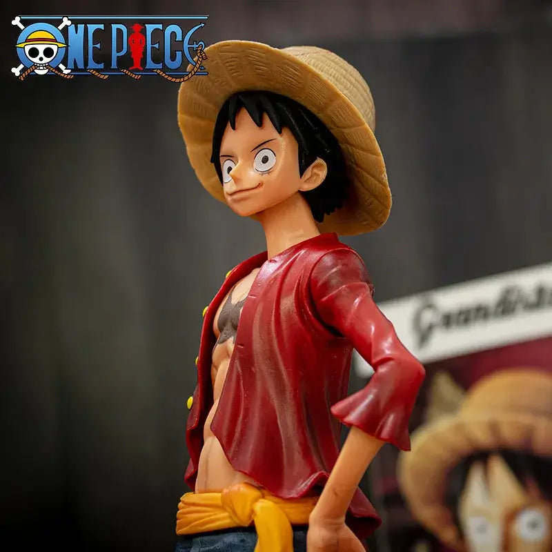 A 28cm One Piece Luffy Figure made of PVC, featuring three interchangeable face plates showing confident and smiley expressions for custom display.
