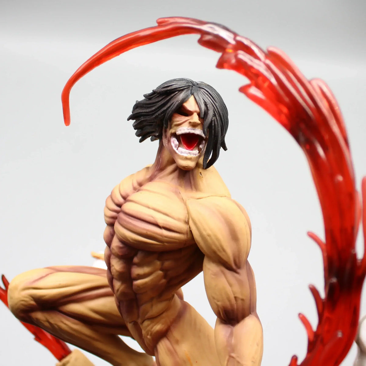 A highly detailed 29cm Eren Jaeger Figure made of premium PVC, showcasing the Attack on Titan protagonist in a dynamic pose for anime desktop decoration.