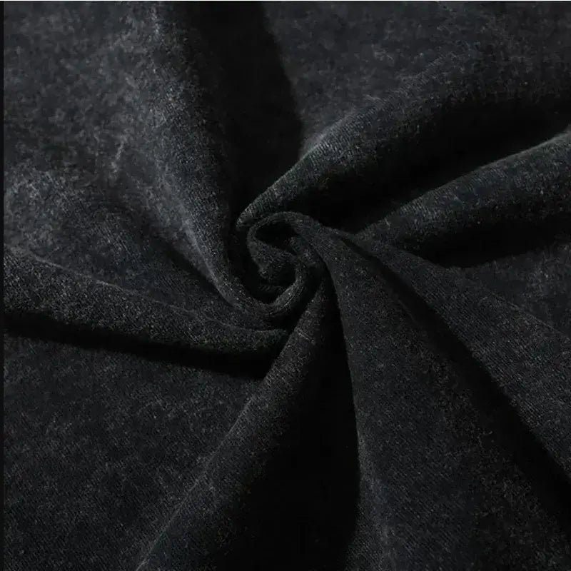 Close-up view of dark fabric texture for Dark Manga Pattern T-Shirt showcasing its quality and softness.