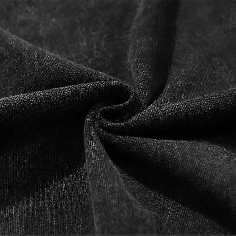 Close-up of the soft fabric texture of Attack on Titan Female Titan Vintage Washed T-Shirt in black.