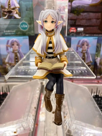 A high-quality 14cm Frieren Anime Figure sitting down, functioning as a noodle stopper and desktop decoration.