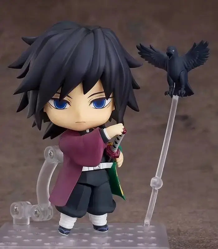 High-quality Demon Slayer Nendoroid Figures featuring Kamado Tanjiro, Nezuko, and Uzui Tengen posing for an upscale anime collection display.