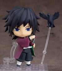 High-quality Demon Slayer Nendoroid Figures featuring Kamado Tanjiro, Nezuko, and Uzui Tengen posing for an upscale anime collection display.
