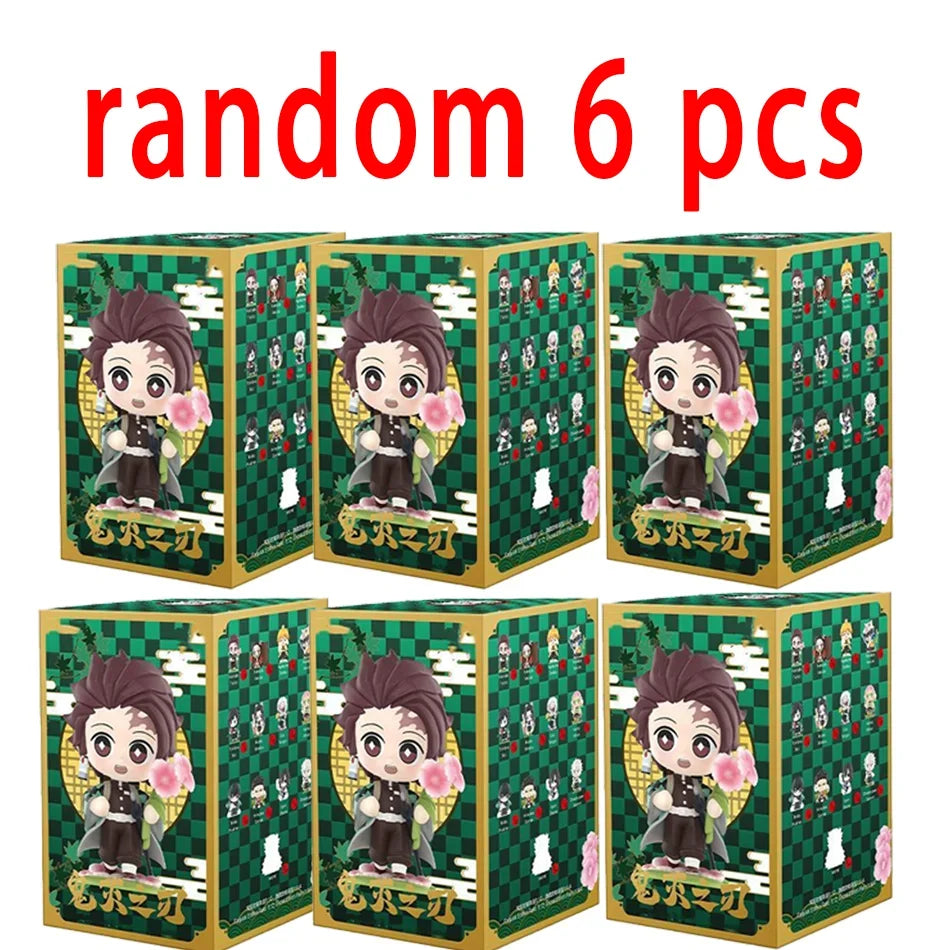 A colorful Demon Slayer Blind Box containing a random cute PVC anime figure of Tanjiro or Nezuko, used as a desktop ornament.