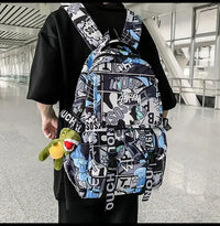 One Piece Luffy Backpack with graffiti print and plush toy, perfect for school and daily use.