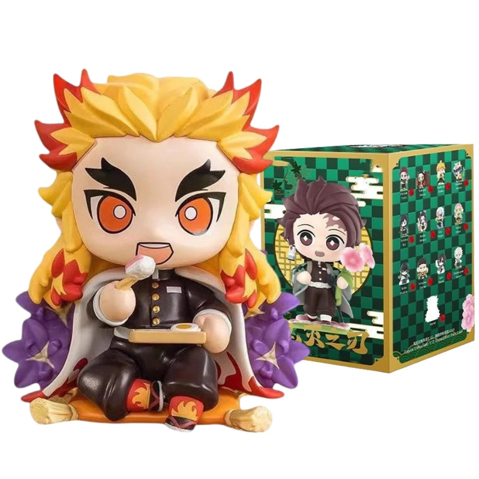 A colorful Demon Slayer Blind Box containing a random cute PVC anime figure of Tanjiro or Nezuko, used as a desktop ornament.