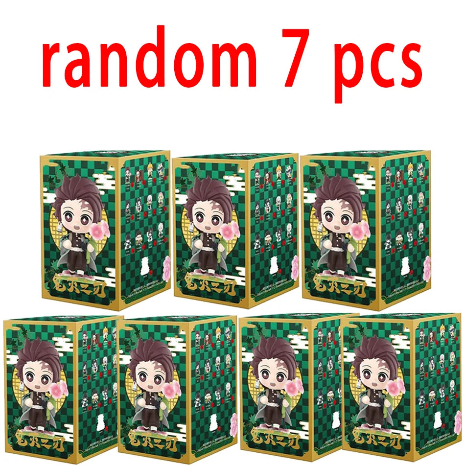A colorful Demon Slayer Blind Box containing a random cute PVC anime figure of Tanjiro or Nezuko, used as a desktop ornament.