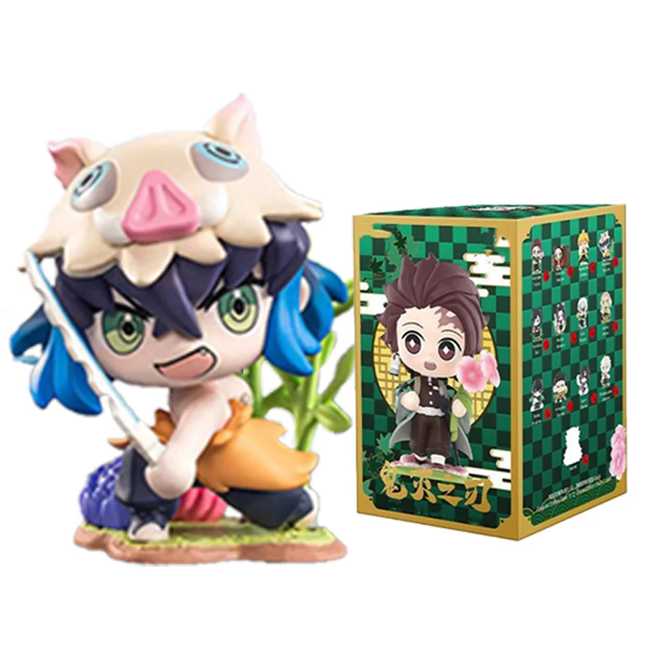 A colorful Demon Slayer Blind Box containing a random cute PVC anime figure of Tanjiro or Nezuko, used as a desktop ornament.