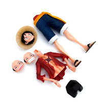 A 28cm One Piece Luffy Figure made of PVC, featuring three interchangeable face plates showing confident and smiley expressions for custom display.