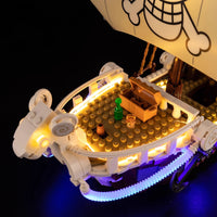 A Going Merry LED Light Set illuminating the 75639 pirate ship building block model, showcasing glowing cabins and deck lights.