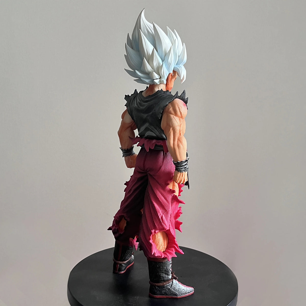 Son Goku Super Saiyan Action Figure displayed on anime desk Dragon Ball PVC collectible statue