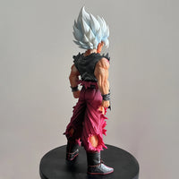 Son Goku Super Saiyan Action Figure displayed on anime desk Dragon Ball PVC collectible statue