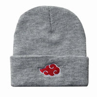 A black knitted Akatsuki Beanie featuring the red cloud embroidery symbol, designed as a warm unisex winter hat for men and women.