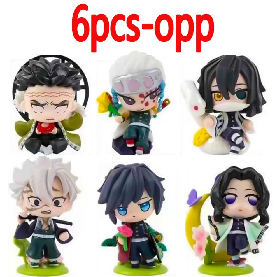 A colorful Demon Slayer Blind Box containing a random cute PVC anime figure of Tanjiro or Nezuko, used as a desktop ornament.