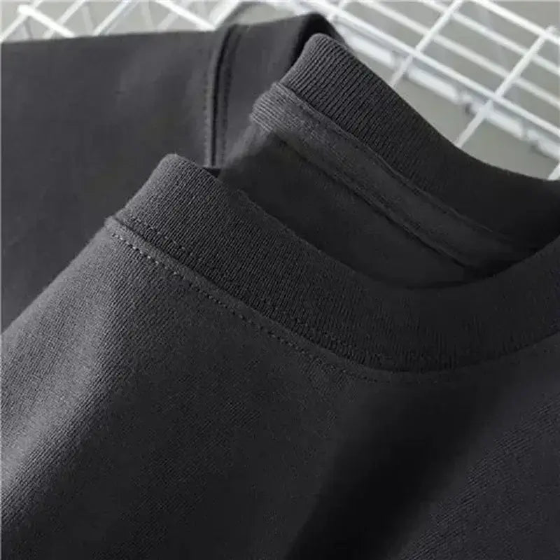 A trendy Solo Leveling Vintage T-shirt featuring a Sung Jinwoo graphic print, designed with a retro washed cotton finish for Harajuku streetwear.