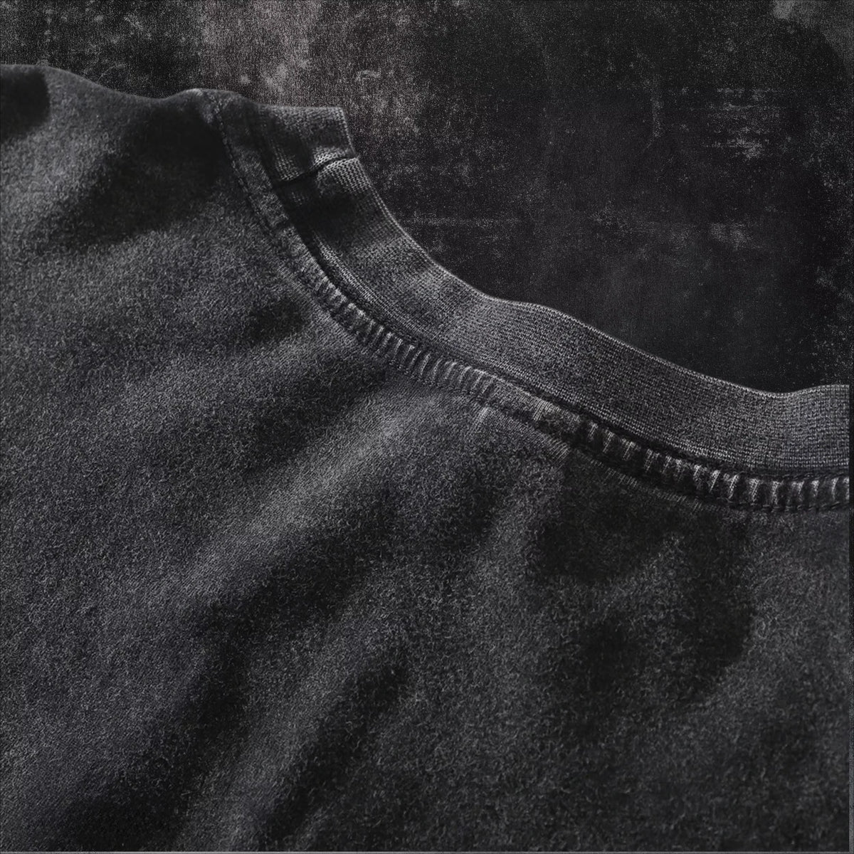 Close-up of the soft fabric texture of the Obito Uchiha Mask Acid Wash T-Shirt in black.