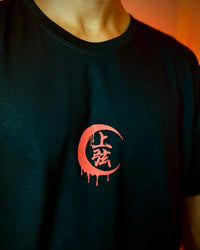 A couple wearing matching oversized Demon Slayer Graphic T Shirts in a hip hop, Y2K streetwear style.
