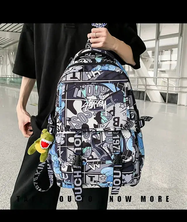 A high-capacity One Piece Luffy Backpack featuring a vibrant graffiti print of Monkey D. Luffy, designed as a durable school bag for middle and high students.