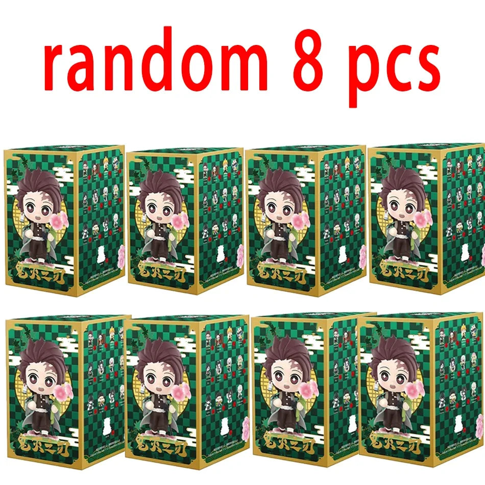 A colorful Demon Slayer Blind Box containing a random cute PVC anime figure of Tanjiro or Nezuko, used as a desktop ornament.