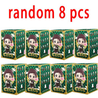 A colorful Demon Slayer Blind Box containing a random cute PVC anime figure of Tanjiro or Nezuko, used as a desktop ornament.