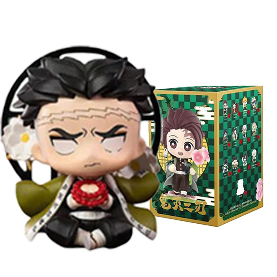 A colorful Demon Slayer Blind Box containing a random cute PVC anime figure of Tanjiro or Nezuko, used as a desktop ornament.