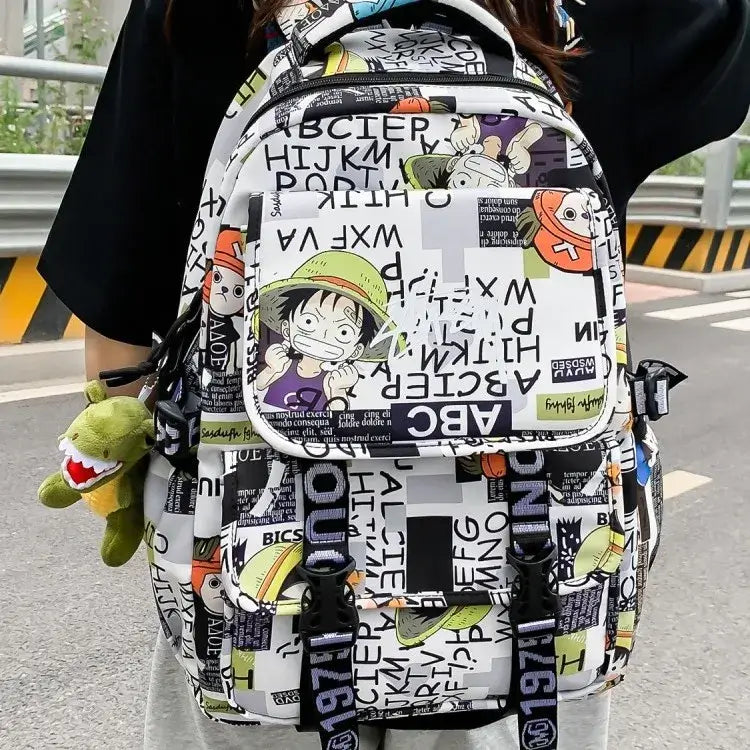 A high-capacity One Piece Luffy Backpack featuring a vibrant graffiti print of Monkey D. Luffy, designed as a durable school bag for middle and high students.