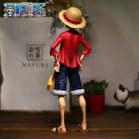 A 28cm One Piece Luffy Figure made of PVC, featuring three interchangeable face plates showing confident and smiley expressions for custom display.