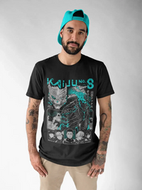 A black Kaiju No 8 T-shirt featuring a manga graphic of Captain Mina Ashiro holding a cannon, styled as a Y2K top for women's clothing.