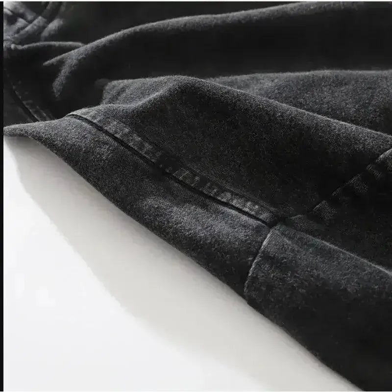 Close-up of the sleeve hem of a Dark Manga Pattern T-Shirt showcasing its detailed stitching and fabric texture.