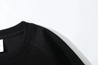 A comfortable Son Goku Hoodie featuring a Japanese anime graphic of Dragon Ball Z, designed as a long-sleeve parent-child outfit for men and boys.