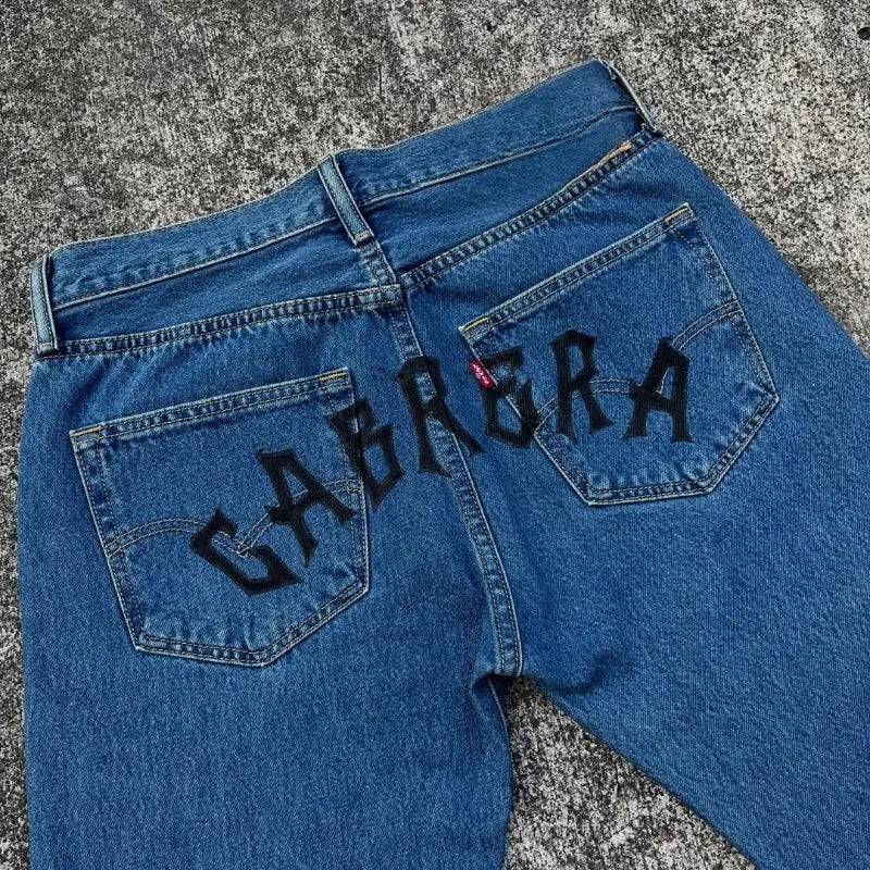 Trendy Cartoon Print Jeans featuring a high street graphic design, styled as loose wide-leg Harajuku denim for men and women.