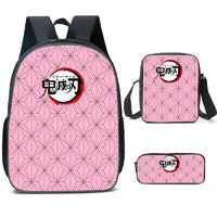 A pink Demon Slayer Backpack 3-piece set featuring Kamado Nezuko anime art, including a schoolbag, shoulder bag, and pencil case for students.