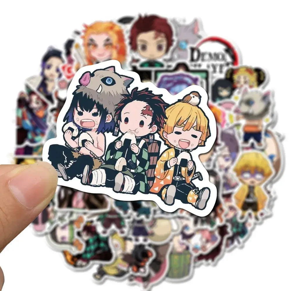 A mixed pack of waterproof Demon Slayer Stickers featuring cute Tanjiro and Nezuko anime art, applied to a laptop and phone case.