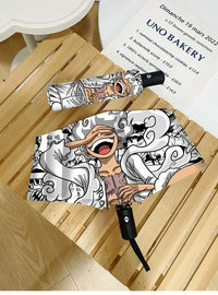 An automatic One Piece Nika Luffy Fold Umbrella with a three-fold design, featuring Gear 5 anime art and black glue sunscreen.
