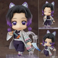 High-quality Demon Slayer Nendoroid Figures featuring Kamado Tanjiro, Nezuko, and Uzui Tengen posing for an upscale anime collection display.
