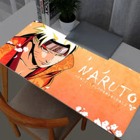A high-quality Naruto Uzumaki Mouse Pad featuring dynamic anime artwork, rolling out on a Gabinete Gamer desk with a Varmilo keyboard and PC mouse.