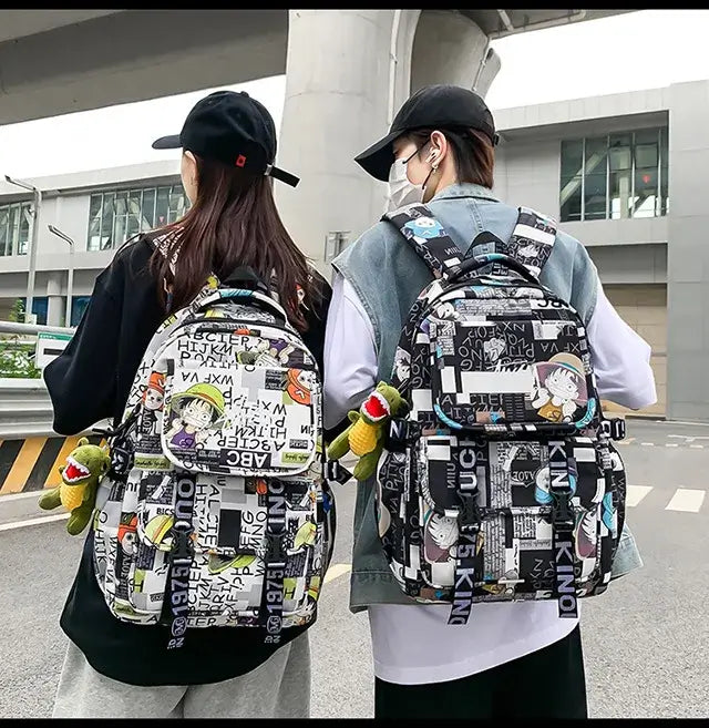 A high-capacity One Piece Luffy Backpack featuring a vibrant graffiti print of Monkey D. Luffy, designed as a durable school bag for middle and high students.