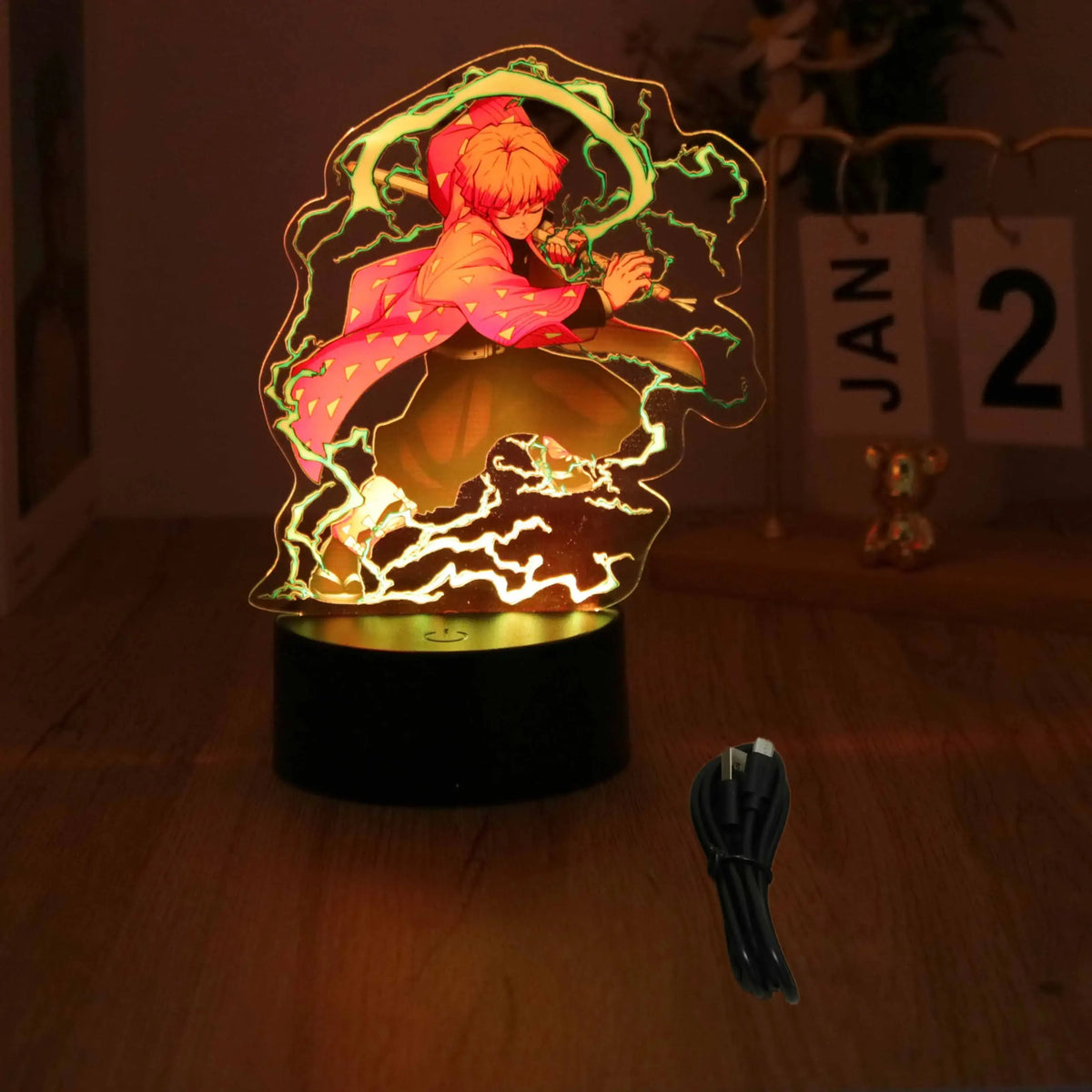 A glowing Demon Slayer 3D Lamp featuring an acrylic Tanjiro and Nezuko figure design, illuminated in blue LED light for bedroom decor.