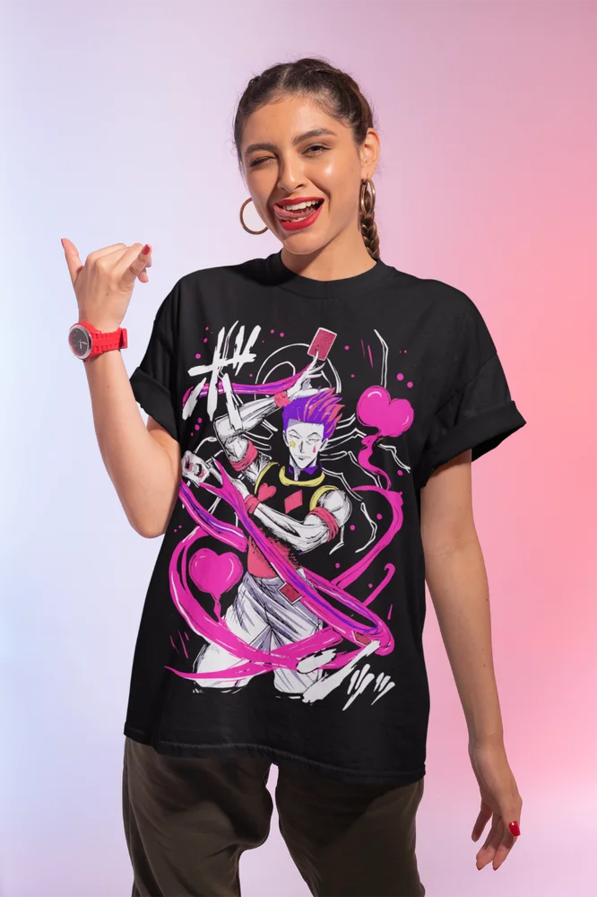 A premium Hisoka Shirt featuring a black and white manga strip graphic of Hisoka Morow from Hunter x Hunter, designed as a soft unisex anime tee.
