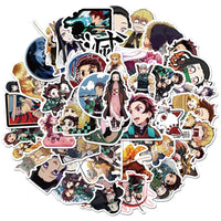 A mixed pack of waterproof Demon Slayer Stickers featuring cute Tanjiro and Nezuko anime art, applied to a laptop and phone case.